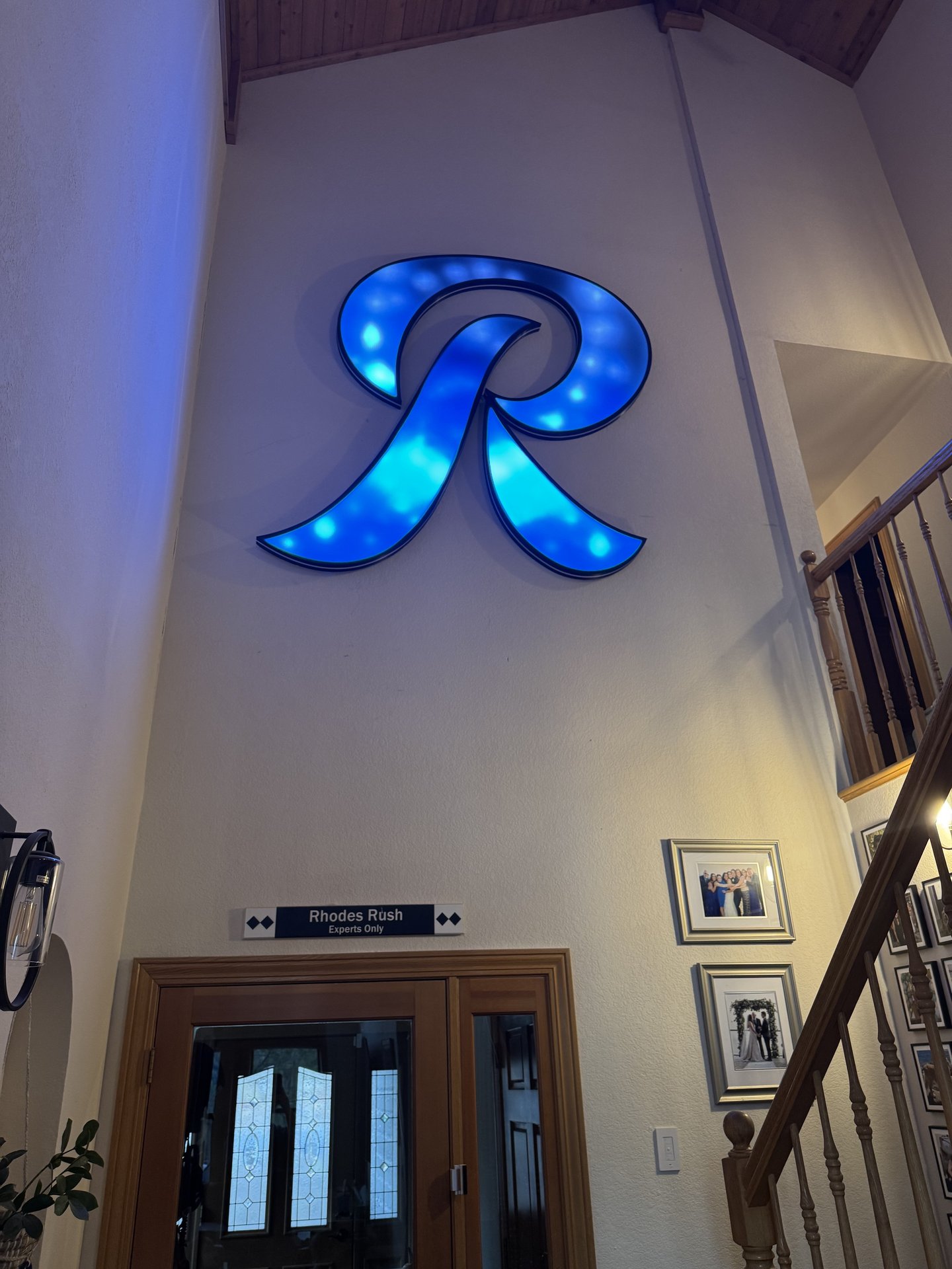 Large script R LED art on cathedral ceiling